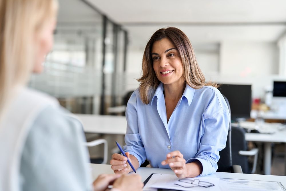 Happy,Middle,Aged,Business,Woman,Hr,Talking,To,Recruit,At